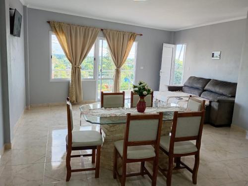 a living room with a table and chairs and a couch at Departamentos Alta Vista 1 in Dos de Mayo