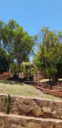 a park with some trees and a stone wall at Apartemento Grande Hohenau Centro in Hohenau