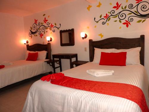 Tempat tidur dalam kamar di Hotel Posada Las Casas