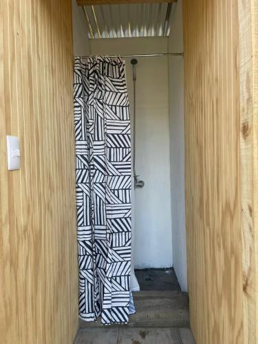 a hallway with a black and white wall at Glamping peumayen in Puerto Varas