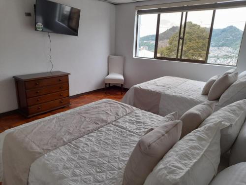 Ліжко або ліжка в номері Modern, Comfortable, Spacious & Central