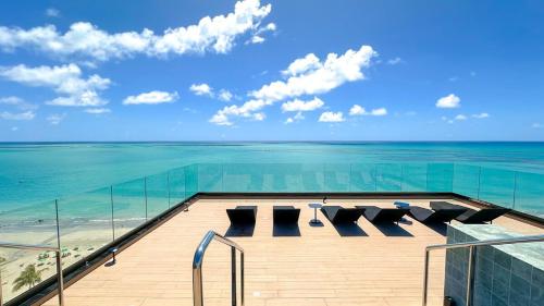 a view of the ocean from the top of a building at Edifício New Time Apto 1016 Pajuçara Maceió AL in Maceió