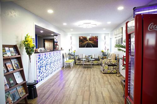 a room with a restaurant with a table and chairs at Express Inn Parsons in Parsons