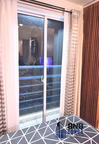 a sliding glass door with a view of a room at Studio2 - BNB Condo Rentals CDO in Lapasan