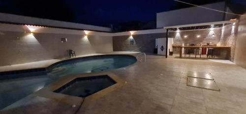 a large swimming pool in the middle of a room at Hermosa y espaciosa casa familiar en Anapoima in Anapoima