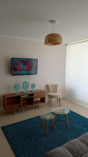 Frente a la mejor playa de Aricaにあるテレビまたはエンターテインメントセンター