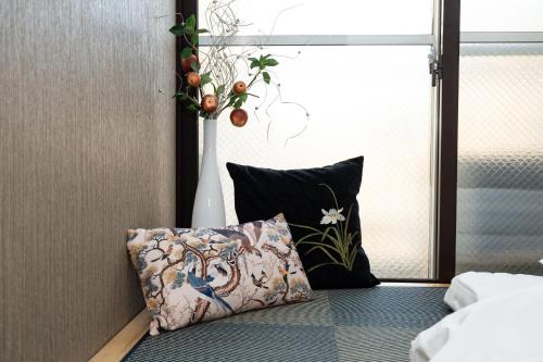 Una cama o camas en una habitación de 匯金上板橋ビル