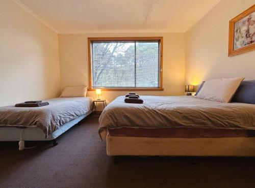 Postel nebo postele na pokoji v ubytování The Bushmill Cottage