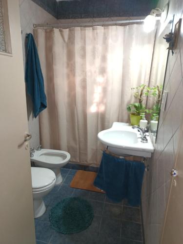 a bathroom with a sink and a toilet at Morena`s Home in Don Torcuato