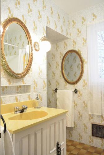 a bathroom with a sink and a mirror at 930R-B1 The Old House in Quebec City