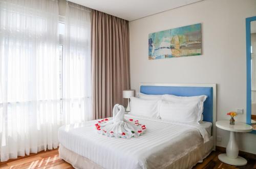 Katil atau katil-katil dalam bilik di Palmier Hotel - Art House Da Nang