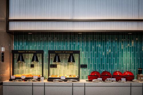 a display window of a bakery with different types of food at Hilton Garden Inn Hefei High-Tech Zone in Hefei
