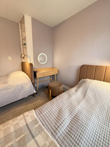 Ένα ή περισσότερα κρεβάτια σε δωμάτιο στο Bright and Spacious Stay