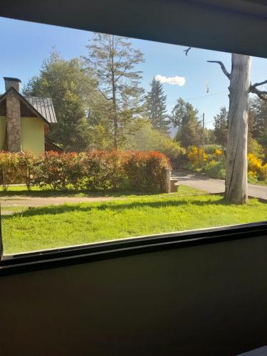a view of a yard from a window at Pueblo Patagonia in Villa La Angostura