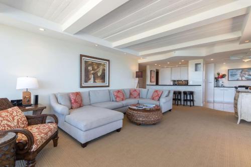 a living room with a couch and a table at Aston at The Whaler on Kaanapali Beach in Lahaina