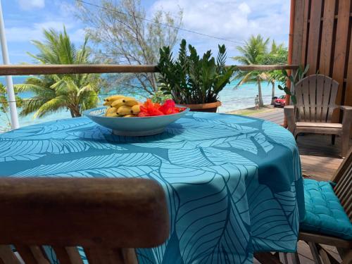 a bowl of fruit sitting on a table on a balcony at BLUE LAGOON - Terrace View & Beach Access - FREE WIFI PARKING - Bora Bora Dream - SPECIAL OFFER in Bora Bora