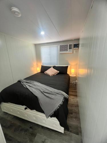 a bedroom with a bed in a small room at Stanthorpe Country Retreat 'Ash Haven' in Greenlands