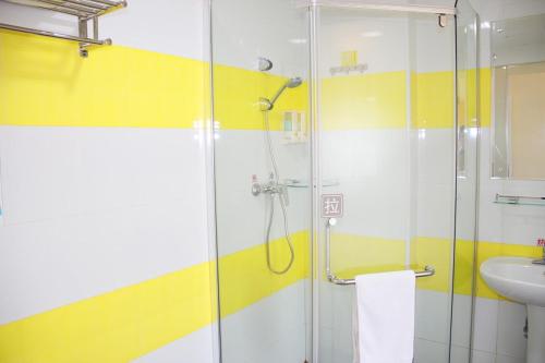 a bathroom with a shower and a sink at 7Days Premuim Suqian Xiangwang Home Village Scenic Spot in Suqian