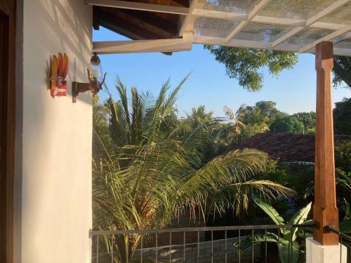 a view of a palm tree from a porch at Margosa villa in Tangalle