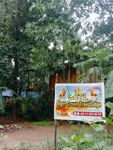 a sign for a skill sixth grown tree lodge at Sigiri Crown Tree Lodge in Sigiriya