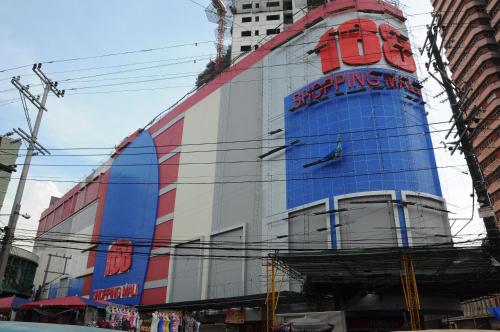 a building with a sign on the side of it at Dela Chambre Hotel in Manila
