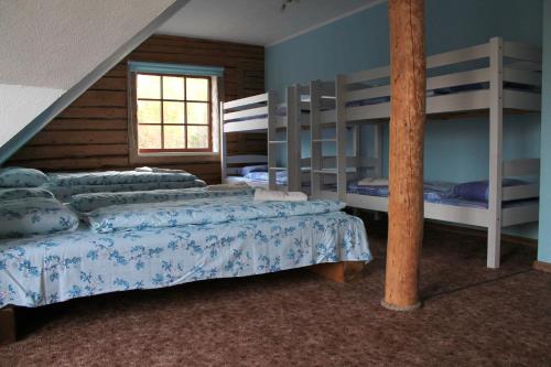 A bed or beds in a room at Reimani Holiday House