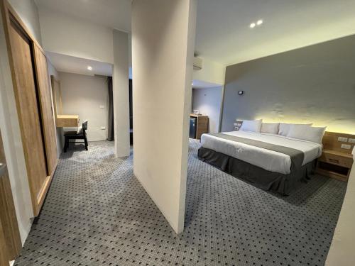 Ένα ή περισσότερα κρεβάτια σε δωμάτιο στο Atlas International Hotels