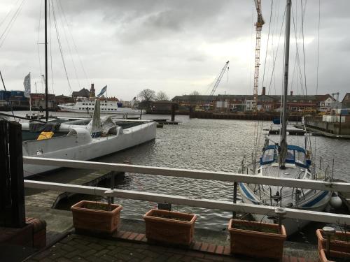 a boat is docked at a dock in the water at City Marina 78 in Cuxhaven