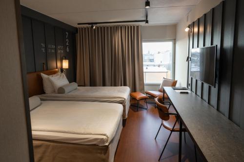 Postel nebo postele na pokoji v ubytování Original Sokos Hotel Seurahuone Kotka