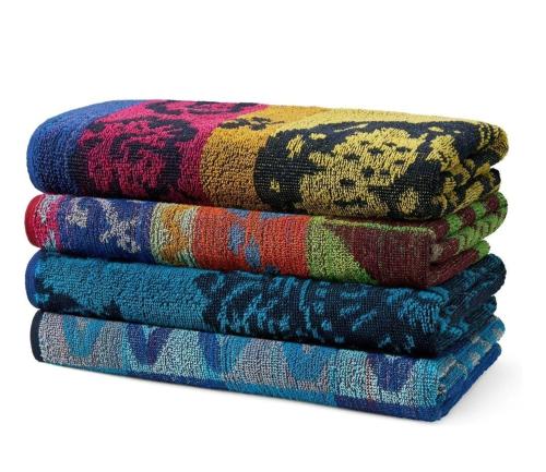 a pile of colorful towels stacked on top of each other at Tampa Private Home Game Room Theater Room & more in Riverview