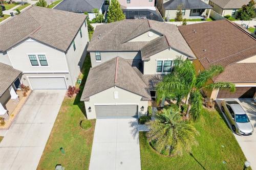 an aerial view of a house with houses at Tampa Private Home Game Room Theater Room & more in Riverview