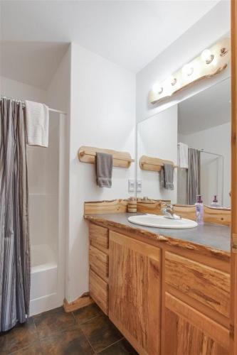 a bathroom with a sink and a mirror at Bear Hideaway | Wi-fi, Hot tub, Wood Stove, BBQ in Packwood