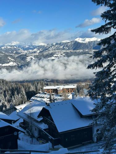 a view of a ski resort with snow covered roofs at Chalet-Style Apartment Sonnleitn Nassfeld in Hermagor