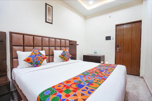 Postel nebo postele na pokoji v ubytování FabHotel Sarja Sky