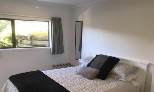 Un ou plusieurs lits dans un hébergement de l'établissement Abel Tasman Kaiteriteri B & B
