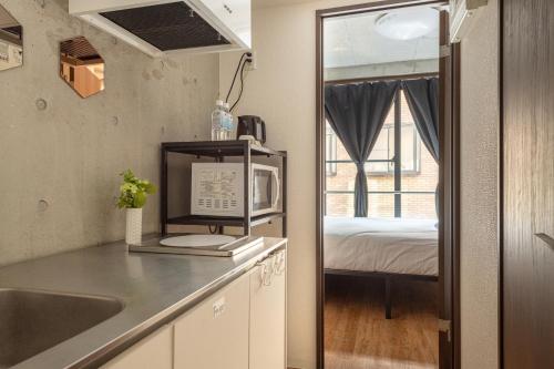 Η κουζίνα ή μικρή κουζίνα στο 台東区台東で快適な宿泊を浅草 上野観光の拠点に