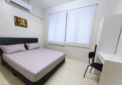 Ένα ή περισσότερα κρεβάτια σε δωμάτιο στο Ong Lai Home Stay