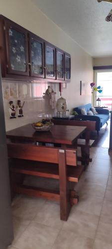 a living room with a table and a couch at casa na Torre in Machico
