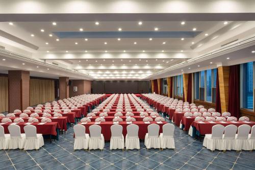 a large room with rows of tables and chairs at Days Hotel by Wyndham Harbin Qunli in Harbin