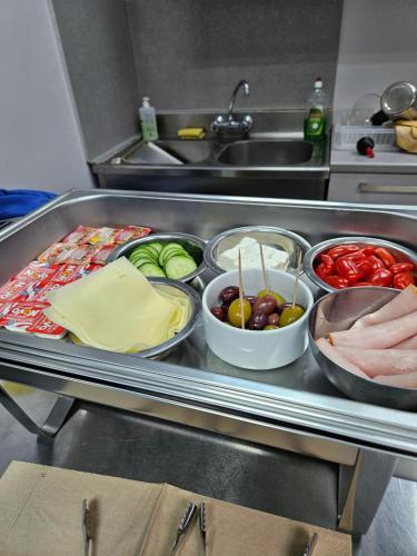a kitchen with many different foods on a tray at DATA Maisonettes and more in Chios