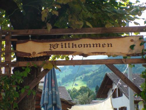 a sign that reads itillinillinomon with a hammock at Hotel Restaurant Simplon in Frutigen