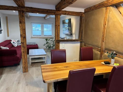 a living room with a table and a couch at Am Graben 2 in Hasselfelde