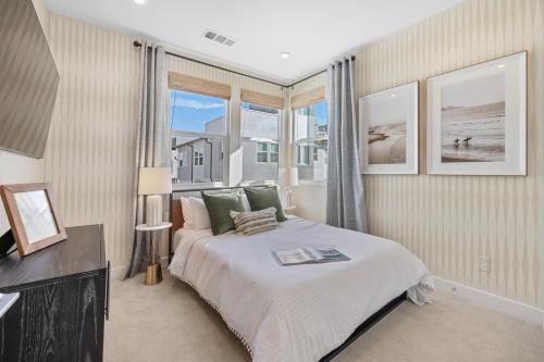 a bedroom with a large bed and a window at #Marbella Lane-Luxury Designer 3BR Home Disneyland in Anaheim