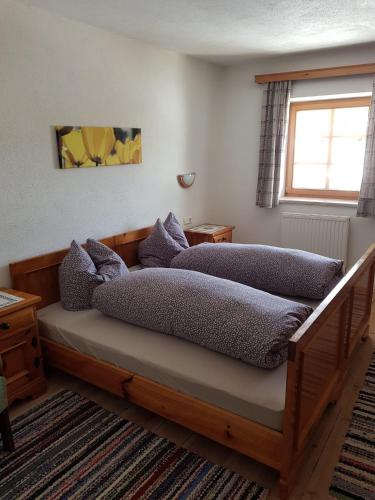 a bedroom with two beds and a window at Hauspircher in Reith bei Seefeld
