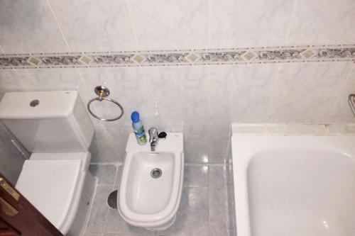 a bathroom with a toilet and a bidet at Charming Apartment in El Grove, Sea View in O Grove