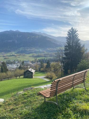 a park bench sitting on top of a hill at Kloster Ilanz in Ilanz