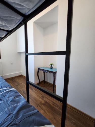 a small table in a room with a bed at City Guli in Tbilisi City