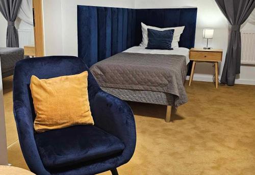 Postel nebo postele na pokoji v ubytování Hotel Ognisty Ptak