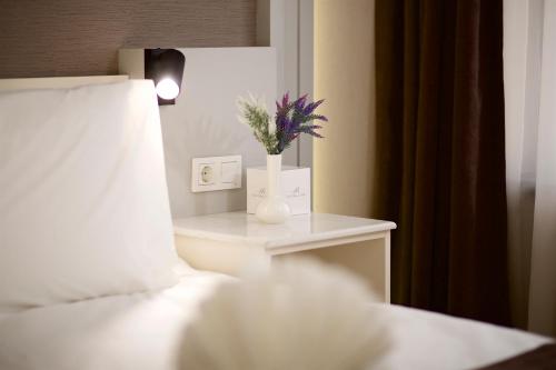Hotel Bulvar Palasにあるベッド