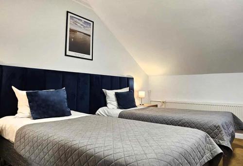 Postel nebo postele na pokoji v ubytování Hotel Ognisty Ptak